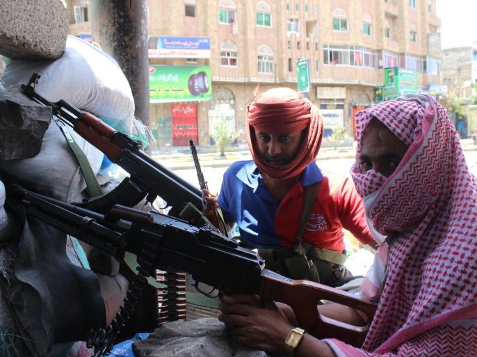 TAIZ, YEMEN - MAY 6: Members of an armed group named 'People's Resistance' established in opposition to Houthi Ansarullah Movement in Taiz stand guard for a possible Houthi attack in Yemen on May 6, 2015.