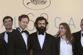 From left, actor Todd Charmont, director Laszlo Nemes, actor Geza Rohrig, screenwriter Clara Royer, and actor Urs Rechn pose for photographers as they arrive for the screening of the film Saul Fia (Son of Saul) at the 68th international film festival, Cannes, southern France, Friday, May 15, 2015. (AP Photo/Lionel Cironneau)