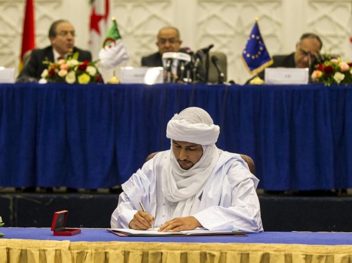Bilal Agh Cherif, secretary general of The Coordination of the Movements of Azawad (CMA), signs a preliminary peace agreement in Algiers, Algeria May 14, 2015. Mali's Tuareg-led rebels signed up to a preliminary peace agreement with the government on Thursday as a step to ending decades of separatist fighting, but said they would need more guarantees before signing a final aaccord. REUTERS/Zohra Bensemra