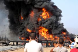 Black smoke rises from the burning crude oil tank at the Aden oil refinery after Houthi fighters attacked the refinery in the southern port city of Aden, Yemen, 27 June 2015. According to reports Houthis targeted the refinery with missiles, and have cut one of the last roads providing aid to non Houthi controlled areas in the city.