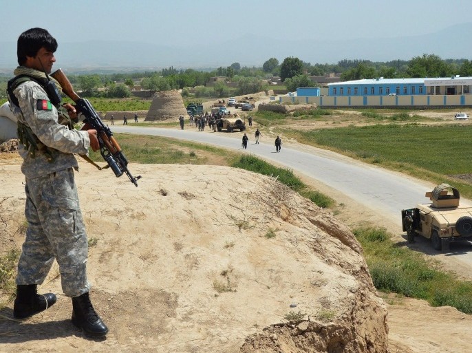 An Afghan security official takes position during an ongoing battle with the Taliban in Kunduz, Afghanistan, 03 May 2015. At least 140 insurgents, 20 Afghan soldiers and five civilians have been killed in clashes between government forces and the Taliban in the northern Kunduz province, a local official said on 29 April. Taliban fighters started a major offensive in Kunduz late April, prompting fears that Kunduz city and other areas would fall to the insurgents, who launched their annual spring offensive. More than 2,000 families have fled the fighting, officials said.