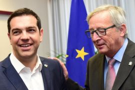 Greek Prime Minister Alexis Tsipras (L) meets with European Commission President Jean-Claude Juncker at the end of a European Union and the Community of Latin America and Caribbean states (EU-CELAC) summit on June 11, 2015 at the European Union headquarters in Brussels. AFP PHOTO/POOL/Emmanuel Dunand
