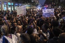 Ethiopian Jewish men chant during a protest in Tel Aviv, Israel, Monday, June 22, 2015. Israel's Jewish Ethiopian minority protested in Tel Aviv against racism and police brutality Monday weeks after an Ethiopian Israeli soldier was beaten by the police. (AP Photo/Tsafrir Abayov)