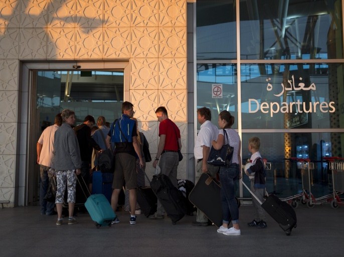 Tourists leave Tunisia at the Enfidha International airport after a shooting attack at the Imperial hotel in the resort town of Sousse, a popular tourist destination 140 kilometres (90 miles) south of the Tunisian capital, on June 27, 2015. At least 38 people, including foreigners, were killed in a mass shooting at a Tunisian beach resort packed with holidaymakers, in the North African country's worst attack in recent history. AFP PHOTO / KENZO TRIBOUILLARD