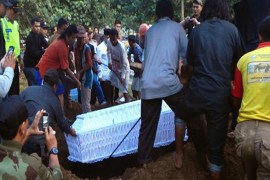 A coffin with the body of Indonesian drug convict Zainal Abidin is buried after he was shot dead by firing squad in April [AFP]