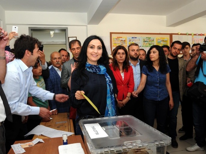 VAN, TURKEY - JUNE 07: Figen Yuksekdag, co-leader of the Peoples' Democratic Party and deputy candidate, casts her ballot at a polling station during Turkey's 25th general election in Van, Turkey on June 7, 2015. More than 53.7 million Turks are eligible to vote in a poll to elect 550 deputies to the Grand National Assembly.