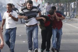 People run away after an explosion during an election campaign rally of the Peoples' Democratic Party (HDP) in Diyarbakir, southeast of Turkey, 05 June 2015. Reports state that 10 people were wounded after the explosion.