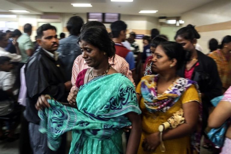 Relatives of people who died of consumption of poisonous liquor mourn at Shatabdi Municipal Hospital, in Mumbai, India, 19 June 2015. At least 33 people have died after consuming illegally brewed alcohol in India's western city of Mumbai's slums in the Malvani areas. Most of the victims were construction workers and auto rickshaw drivers and police have detained three suspects in connection with the deaths, and sent samples of the drink to be analyzed, a news reports said.