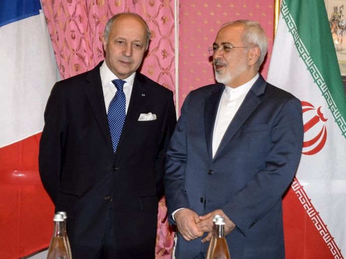 French Foreign Minister Laurent Fabius (L) meets with Iranian counterpart Mohammad Javad Zarif during nuclear talks in Lausanne on March 28, 2015. Fabius arrived at nuclear talks with Iran in Switzerland saying he wants to achieve a 'robust' deal. AFP PHOTO / FABRICE COFFRINI