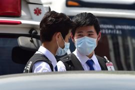 South Korean hospital security guards wear masks at the Seoul National University Hospital in Seoul on June 2, 2015. South Korea's health ministry confirmed that two people have died from Middle East Respiratory Syndrome (MERS), the country's first fatalities from the virus. AFP PHOTO / JUNG YEON-JE