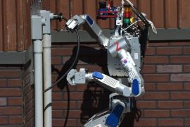 The humanoid robot 'DRC-Hubo' developed by Team KAIST from South Korea completes a task before winning the finals of the DARPA Robotics Challenge at the Fairplex complex in Pomona, California on June 6, 2015. Robots from six countries including the United States, Japan and South Korea competed against each other in a disaster response challenge inspired by the 2011 Fukushima nuclear meltdown. AFP PHOTO/MARK RALSTON