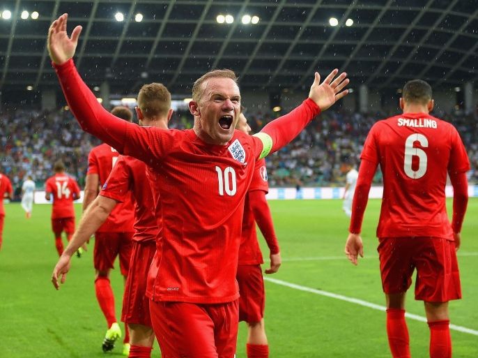 LJUBLJANA, SLOVENIA - JUNE 14: Wayne Rooney of England celebrates scoring their third goal and victory in the UEFA EURO 2016 Qualifier between Slovenia and England on at the Stozice Arena on June 14, 2015 in Ljubljana, Slovenia.