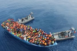 In this picture taken on Saturday June 6, 2015 and made available on Monday, June 8, 2015, provided by Irish Defence Forces, officers of the Irish Navy ship Le Eithne rescue migrants in the Mediterranean Sea. Heartened by recent election successes by an anti-immigrant party, Italian politicians based in the north vowed Sunday not to shelter any more migrants saved at sea, even as thousands more were being rescued in the Mediterranean from smugglers' boats in distress. (AP Photo/Irish Defence Forces via AP)