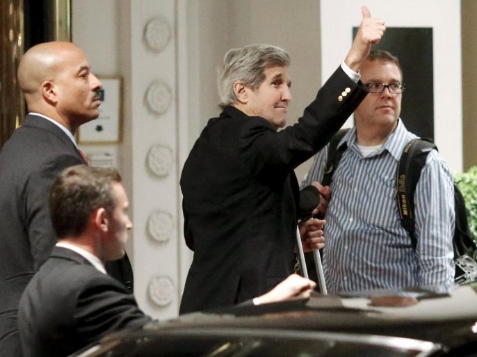 U.S. Secretary of State John Kerry gestures to tourists outside his hotel upon arrival in Vienna, Austria, June 26, 2015. Kerry is about to join negotiations from six powers and Iran seeking an agreement under which Tehran would curb its nuclear program in exchange for relief from economic sanctions that have crippled its economy. REUTERS/Leonhard Foeger