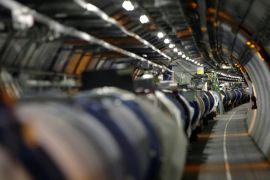 FILE - A May 31, 2007 file photo shows the the LHC (large hadron collider) in its tunnel at CERN near Geneva, Switzerland. The world's biggest particle accelerator is back in action after a two-year shutdown and upgrade, embarking on a new mission that scientists hope could give them a look into the unseen dark universe. Scientists at the European Organization for Nuclear Research, or CERN, on Sunday April 5 2015 shot two particle beams through LHC's 27-kilometer (16.8-mile) tunnel, beneath the Swiss-French border. (AP Photo/Keystone, Martial Trezzini, File)