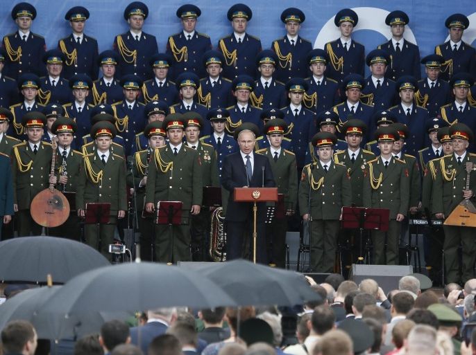 Russian President Vladimir Putin (C) takes a speech opening the International Military-Technical Forum 'ARMY-2015' in the Russian Armed Forces 'Patriot' park in Kubinka, Moscow region, Russia, 16 June 2015. Hundreds of the Russian defense companies and weapon manufacturers will take part in the event, displaying an estimated 5,000 pieces of weaponry and military equipment, ranging from helicopters and fighter jets to tanks and small arms.
