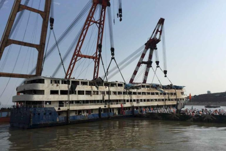 Rescue workers enter the salvaged cruise ship Eastern Star on the Yangtze River, Jianli, Hubei province, June 6, 2015. The death toll from the Chinese cruise ship which capsized during a storm in the Yangtze River jumped to 396 on Saturday, leaving fewer than 50 still missing, as the boat operator apologised and said it would cooperate with investigations. REUTERS/cnsphoto CHINA OUT. NO COMMERCIAL OR EDITORIAL SALES IN CHINA