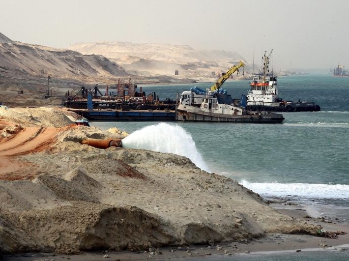Dredgers work on a section of the New Suez Canal in Ismailia, Egypt, 13 June 2015. According to reports, Egypt has set the date for opening of the New Suez Canal for 06 August 2015.