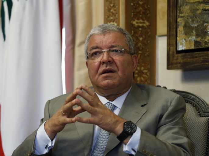 Lebanon's Interior Minister Nohad Machnouk speaks during an interview with Reuters at his office in Beirut July 9, 2014. The success of the Islamic State in Iraq and Syria has emboldened like-minded militants in Lebanon who believe they can emulate it, Machnouk said, confirming the militant Sunni group had now appeared in Beirut for the first time. Machnouk also signalled there would be no quick end to the political instability buffeting Lebanon. He forecast the country would remain without a president for at least six more months. Picture taken July 9. To match Interview LEBANON-MINISTER/ REUTERS/Mohamed Azakir (LEBANON - Tags: POLITICS CIVIL UNREST)
