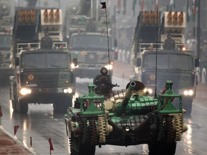 An Indian army tank and multiple launch rocket systems roll down the street as part of the Republic Day parade in New Delhi January 26, 2015. India celebrated its 66th Republic Day on Monday. REUTERS/Ahmad Masood (INDIA - Tags: MILITARY ANNIVERSARY SOCIETY)