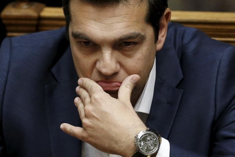 Greek Prime Minister Alexis Tsipras is pictured before his speech at a parliamentary session to brief lawmakers over the ongoing talks with the country's lenders, in Athens, Greece June 5, 2015. Tsipras on Friday branded a cash for reforms proposal by his country's creditors an "absurd" one that he cannot accept and said he hoped it would be taken back. In an uncompromising speech to parliament, Tsipras said a proposal by Athens made earlier this week was the only realistic basis for a deal with creditors. REUTERS/Alkis Konstantinidis TPX IMAGES OF THE DAY