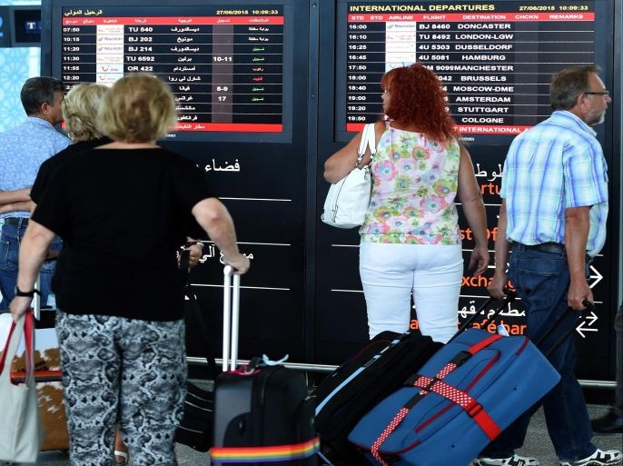 Tourists leave Tunisia at the Enfidha International airport on June 27, 2015, in the aftermath of a shooting attack on the Riu Imperial Marhaba Hotel in Port el Kantaoui, on the outskirts of Sousse south of the capital Tunis. Thousands of scared foreign holidaymakers were being flown from Tunisia after an Islamist gunman killed at least 38 people, most of them British tourists, at the beach resort. AFP PHOTO / FETHI BELAID