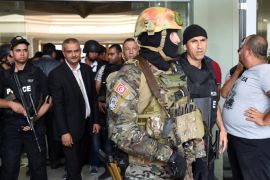Tunisian security forces stand in front of the Imperial hotel in the resort town of Sousse, a popular tourist destination 140 kilometres (90 miles) south of the Tunisian capital, on June 26, 2015, following a shooting attack. At least 27 people, including foreigners, were killed in a mass shooting at a Tunisian beach resort packed with holidaymakers, in the North African country's worst attack in recent history. AFP PHOTO / FETHI BELAID