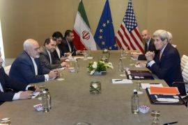 U.S. Secretary of State John Kerry, right, speaks with Iranian Foreign Minister Mohammad Javad Zarif, second left, prior to a bilateral meeting for a new round of Nuclear Talks with Iran at the Intercontinental Hotel, in Geneva, Switzerland, Saturday, May 30, 2015. A month out from a nuclear deal deadline, the top U.S. and Iranian diplomats gathered in Geneva Saturday in an effort to bridge differences over how quickly to ease economic sanctions on Tehran and how significantly the Iranians must open up military facilities to international inspections. (Laurent Gillieron/Keystone via AP)