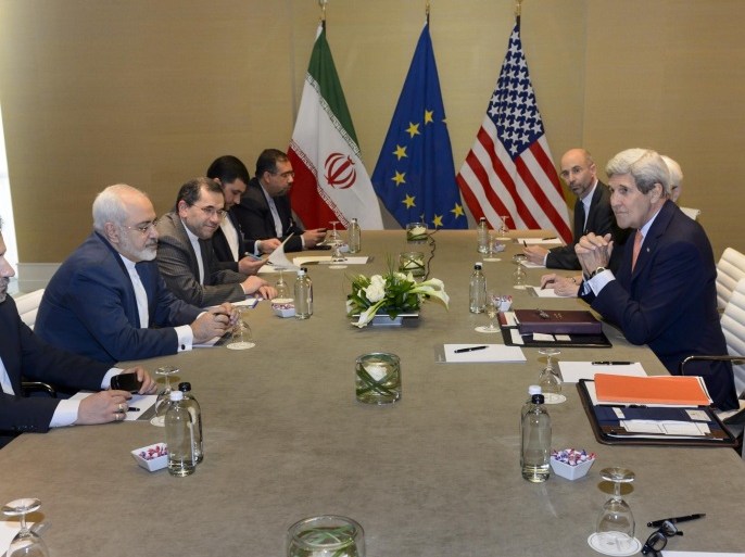 U.S. Secretary of State John Kerry, right, speaks with Iranian Foreign Minister Mohammad Javad Zarif, second left, prior to a bilateral meeting for a new round of Nuclear Talks with Iran at the Intercontinental Hotel, in Geneva, Switzerland, Saturday, May 30, 2015. A month out from a nuclear deal deadline, the top U.S. and Iranian diplomats gathered in Geneva Saturday in an effort to bridge differences over how quickly to ease economic sanctions on Tehran and how significantly the Iranians must open up military facilities to international inspections. (Laurent Gillieron/Keystone via AP)