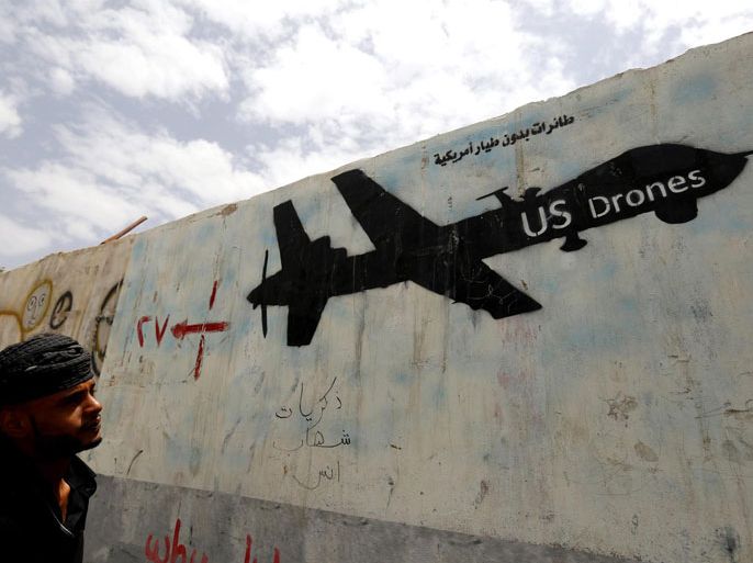 A Yemeni man looks at graffiti showing a US drone after al-Qaeda in Yemen confirmed the death of its leader in US drone strike, in Sana'a, Yemen, 16 June 2015. The leader of al-Qaeda in the Arabian Peninsula (AQAP), Nasir al-Wuhayshi, has been killed in a drone strike on 12 June in Mukalla in Yemen, the Yemeni branch of al-Qaeda confirmed on 16 June. Al-Wuhayshi was second-in-command of global terrorist network al-Qaeda after Ayman al-Zawahiri and was on a US list of most-wanted fugitives for planning attacks on United States soil.