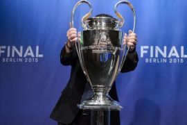 (FILE) A file picture dated 23 April 2015 of an UEFA staff member placing the UEFA Champions League trophy on a podium during the UEFA Champions League semi final draw at the UEFA headquarters in Nyon, Switzerland. Juventus FC will face FC Barcelona in the 2015 UEFA Champions League final at Olympic Stadium in Berlin, Germany on 06 June 2015.