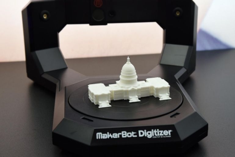 LAS VEGAS, NV - JANUARY 06: A MakerBot Digitizer desktop 3D scanner is displayed with a miniaturized Capitol Building on it at the 2015 International CES at the Sands Expo and Convention Center on January 6, 2015 in Las Vegas, Nevada. The scanner turns 3D objects into computer files so a 3D printer can copy them. CES, the world's largest annual consumer technology trade show, runs through January 9 and is expected to feature 3,600 exhibitors showing off their latest products and services to about 150,000 attendees.