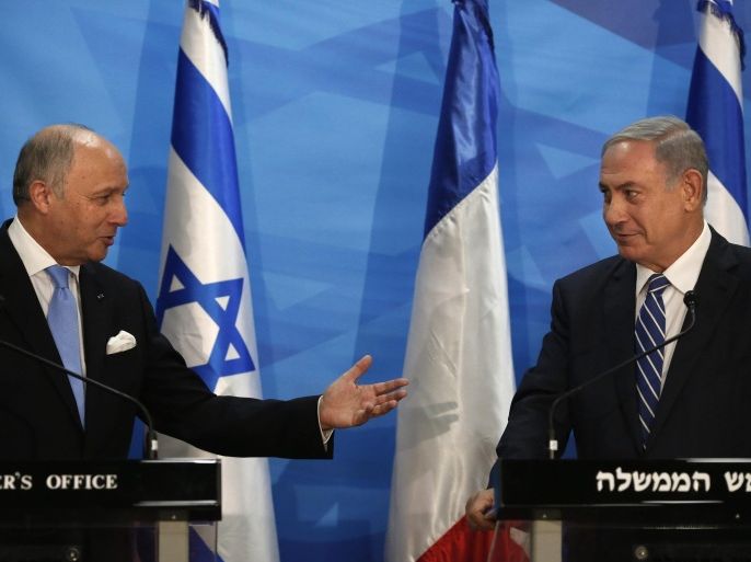 French Foreign Minister Laurent Fabius (L) gestures towards Israeli Prime Minister Benjamin Netanyahu (R) during a joint press conference at the Israeli Prime minister's office in Jerusalem, 21 June 2015. Fabius, during a visit to Cairo earlier in the week, urged the resumption of Middle East peace talks, while warning that continued Israeli settlement building on land the Palestinians want for a future state would damage chances of a final deal.  EPA/THOMAS COEX / POOL POOL