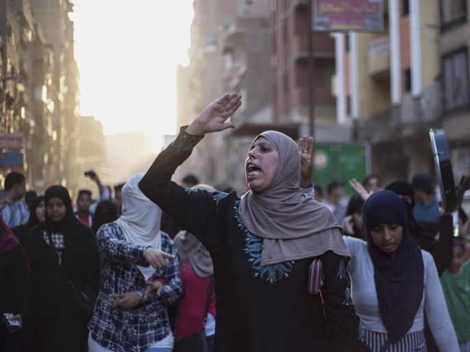 Supporters of the Muslim Brotherhood chant slogans against the Egyptian court ruling of the death sentence for ousted Islamist President Mohammed Morsi over a mass prison break during the country's 2011 uprising, while holding a protest in Cairo, Egypt, Tuesday, June 16, 2015. Other imprisoned members of Morsi's Muslim Brotherhood also received death and life sentences on Tuesday. (AP Photo/Belal Darder)