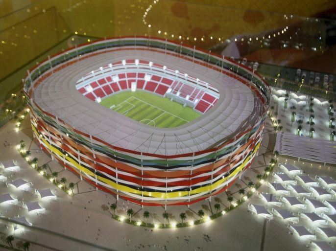 FILE-- In this Sept. 16, 2010 file photo, Qatar presents a model of its Al-Gharafa stadium, as the host of the 2022 World Cup, in Doha, Qatar. Global football executives will fly into Qatar this week to conclude discussions on when the 2022 World Cup should be played. The outcome already seems clear: football’s biggest event will be played in November and December for the first time unless FIFA unexpectedly gives into European opposition. (AP Photo/Osama Faisal, File)