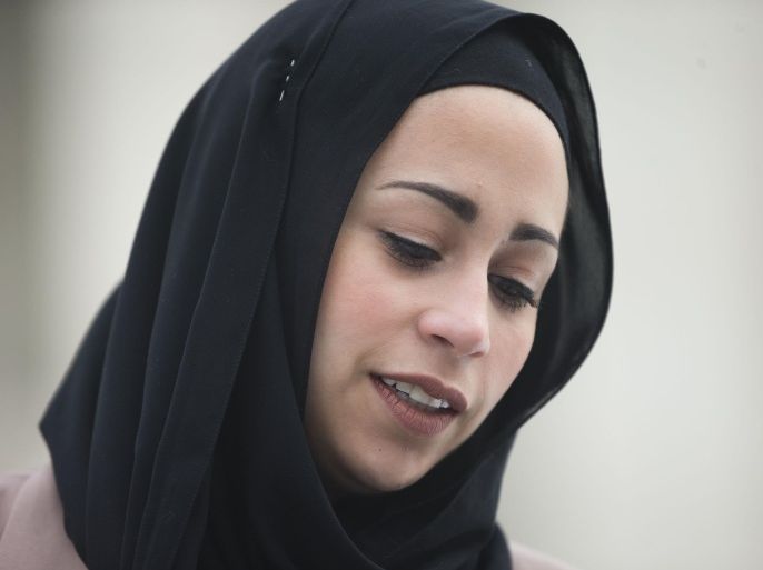 Samantha Elauf stands outside the Supreme Court in Washington, Wednesday, Feb. 25, 2015. The Supreme Court is indicating it will side with a Muslim woman who didn't get hired by clothing retailer Abercrombie & Fitch because she wore a black headscarf that conflicted with the company's dress code to her job interview. Liberal and conservative justices aggressively questioned the company's lawyer during arguments at the high court Wednesday in a case that deals with when an employer must take steps to accommodate the religious beliefs of a job applicant or worker. (AP Photo/Pablo Martinez Monsivais)