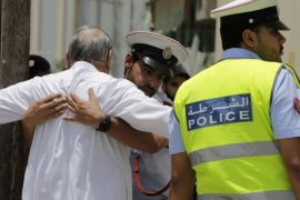 Bahraini community police officers search worshipers outside a Shiite Muslim mosque ahead of mid-day prayers in Manama, Bahrain, Friday, June 5, 2015. Bahraini government and religious authorities are taking extra precautions in the wake of suicide bombing attacks on Shiite mosques the past two Fridays in neighboring Saudi Arabia that were claimed by the Islamic State group and killed 26 people. (AP Photo/Hasan Jamali)