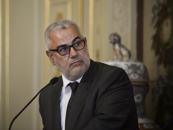 Head of Government of Morocco Abdelilah Benkirane listents to his Portuguese counterpart as they give a joint press conference during the Portugal-Morocco Summit at Necessidades Palace in Lisbon on April 20, 2015. AFP PHOTO/ PATRICIA DE MELO MOREIRA