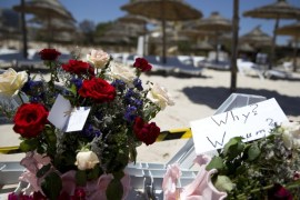 Flower bouquets are seen at the site of a shooting attack on the beach in front of the Riu Imperial Marhaba Hotel in Port el Kantaoui, on the outskirts of Sousse south of the capital Tunis, on June 27, 2015. The Islamic State (IS) group claimed responsibility on June 27 for the massacre in the seaside resort that killed nearly 40 people, most of them British tourists, in the worst attack in the country's recent history. AFP PHOTO / KENZO TRIBOUILLARD
