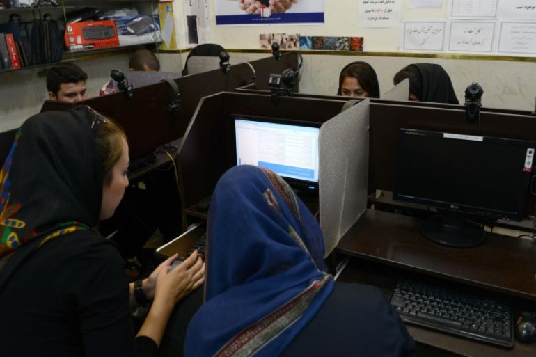 TEHRAN, IRAN - OCTOBER 13: Young women use filtered internet in a coffee net on October 13, 2013 in Tehran, Iran. Socila media networks such as Facebbok, Twitter, Youtube are filtered in Iran and users can only access these sites using a virtual private network otherwise known as VPN.