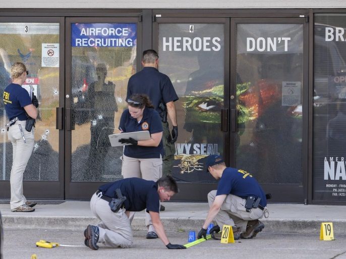 Members of a Federal Bureau of Investigations (FBI) Evidence Response Team work outside a US Military Recruiting storefront after a shooting in Chattanooga, Tennessee, USA, 16 July 2015. Authorities say the shootings at two different locations left four US Marines and the gunman Mohammod Youssuf Abdulazeez dead.