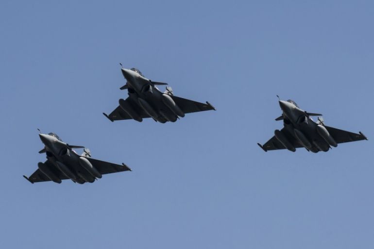 Three French made Rafale fighter jets fly with other Egyptian air force warplanes (unseen) above Cairo, on July 21, 2015