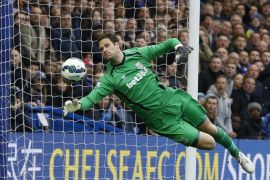 Stoke's Asmir Begovic makes a save during the English Premier League soccer match between Chelsea and Stoke City at Stamford Bridge stadium in London, Saturday, April 4, 2015. (AP Photo/Kirsty Wigglesworth)