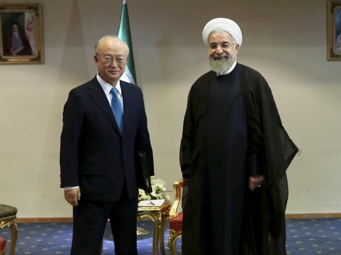 Iran's President Hassan Rouhani, right, welcomes the International Atomic Energy Agency's director-general, Yukiya Amano, as they pose for photos at the start of their meeting in Tehran, Iran, Thursday, July 2, 2015. The head of the U.N. atomic agency, Amano, visited Tehran to discuss remaining outstanding issues over Iran's nuclear program. (AP Photo/Ebrahim Noroozi)