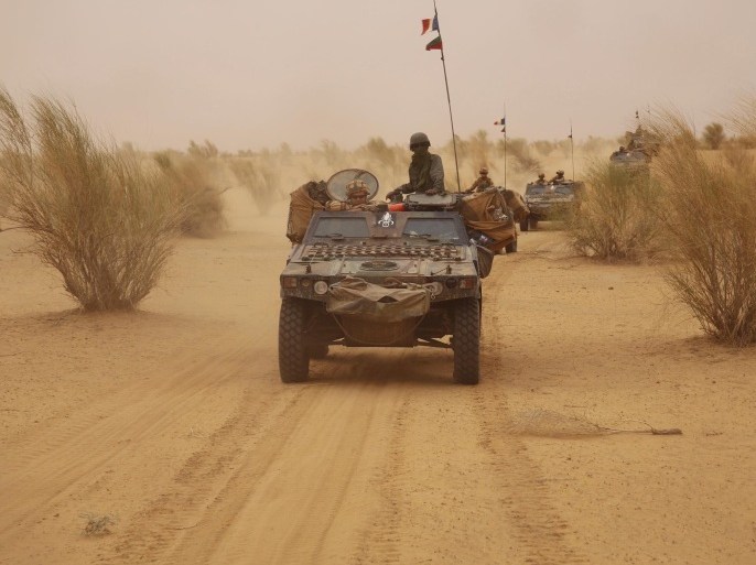 In this photo taken June 24, 2015, French forces patrol in the desert of Northern Mali along the border with Niger on the outskirts of Asongo, Northern Mali. French forces help to disarm groups in northern Mali after a peace deal reached. (AP Photo/Maeva Bambuck )