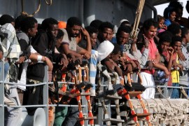 Migrants wait to disembark from the Irish naval ship Le Eithne, at the Palermo harbor, Italy, Tuesday, June 30, 2015. (AP Photo/Alessandro Fucarini)