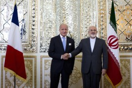 Iranian Foreign Minister Mohammad Javad Zarif (R) shakes hands with his French counterpart Laurent Fabius prior to their talks in Tehran on July 29, 2015. Fabius's visit to Iran comes after the conclusion of a landmark deal with the United States over the Islamic republic's controversial nuclear programme. AFP PHOTO / BEHROUZ MEHRI
