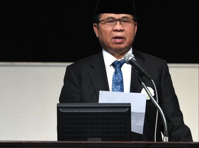 Chairman of the Moro Islamic Liberation Front Murad Ebrahim delivers his speech during a high level seminar on Peace building, National Reconciliation and Democratization in Asia at the United Nations University in Tokyo on June 20, 2015. AFP PHOTO / TOSHIFUMI KITAMURA