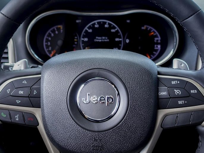 The logo of Jeep is seen on a steering wheel of the 2015 Jeep Grand Cherokee on a car dealership in New Jersey, July 24, 2015. Fiat Chrysler will recall 1.4 million vehicles in the United States to install software to prevent hackers from gaining remote control of the engine, steering and other systems in what federal officials said was the first such action of its kind. The recalled vehicles include some of the top-selling FCA products including the Jeep Grand Cherokee and Cherokee SUVs from model years 2014 and 2015 and 2015 Dodge Challenger sports coupes, among others. REUTERS/Eduardo Munoz