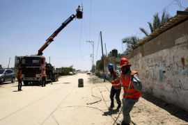 RAFAH, GAZA - AUGUST 6: Power lines are repaired during 72-hour humanitarian ceasefire in Rafah, Gaza on 6 August, 2014.